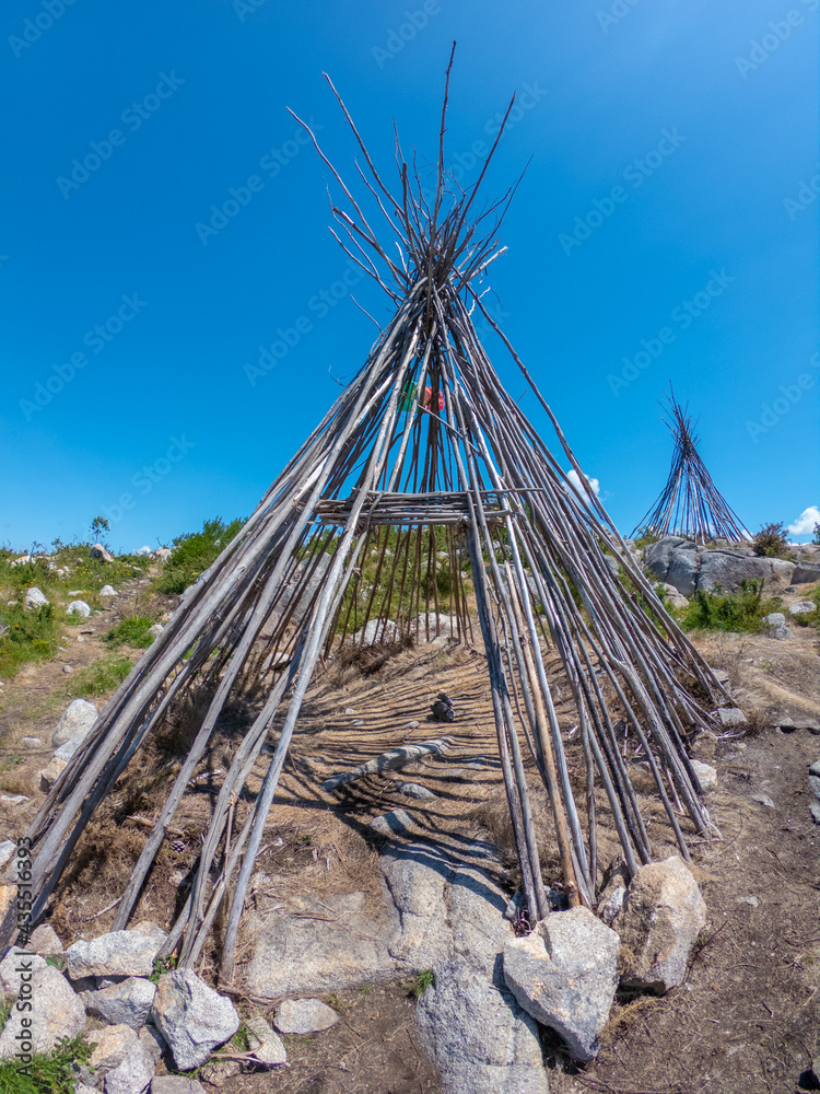 The Patio das Cabanas (Huts Courtyard) in Vila Cha, Esposende, Portugal. Wooden stick hut house, looking like Indian tepee with a beautiful panorama view towards the Portuguese coastline. The Patio das Cabanas (Huts Courtyard) in Vila Cha, Esposende, Portugal. Wooden stick hut house, looking like Indian tepee with a beautiful panorama view towards the Portuguese coastline.