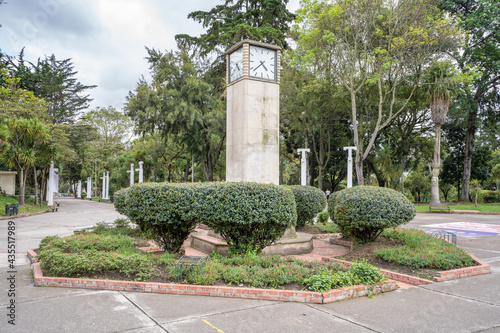 the Swiss clock tower atThe Enrique Olaya Herrera national park, Bogota, Colombia photo