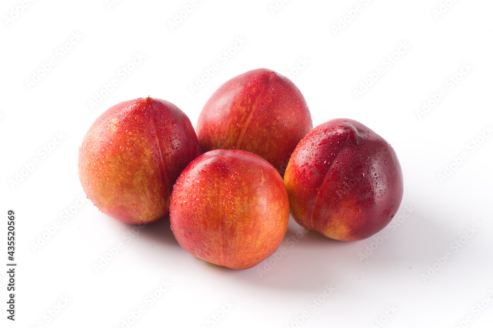 Group of whole nectarine fruits isolated on white background Group of whole nectarine fruits isolated on white background