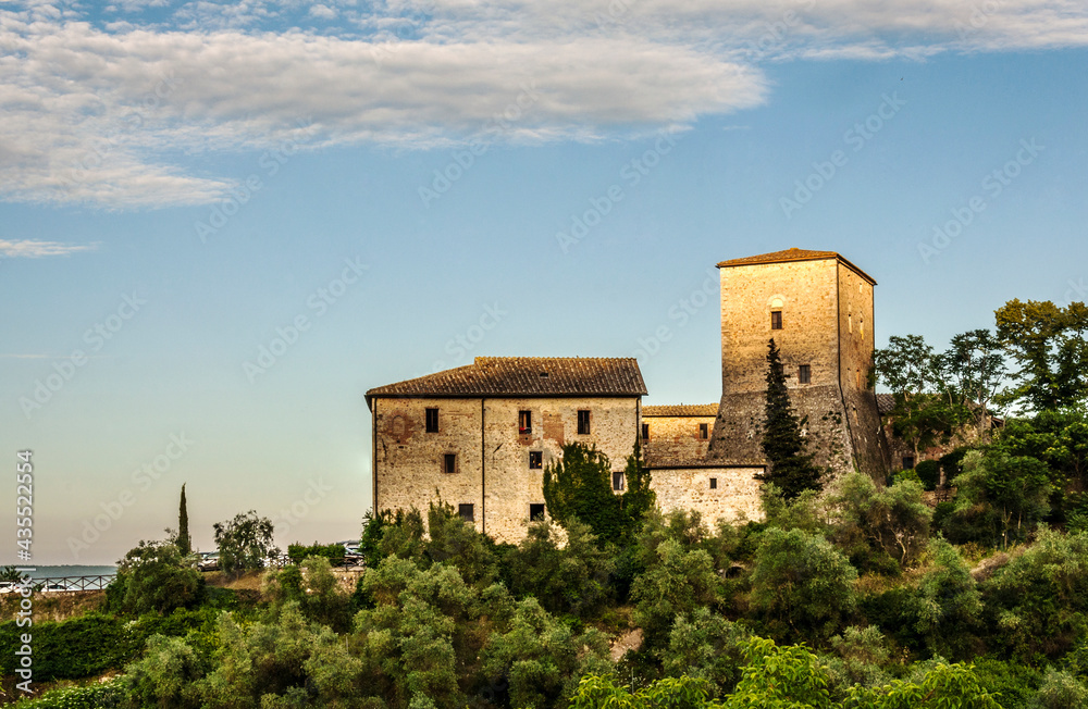 Panoramic view of the Tuscan hills with medieval houses surrounded by blooming nature