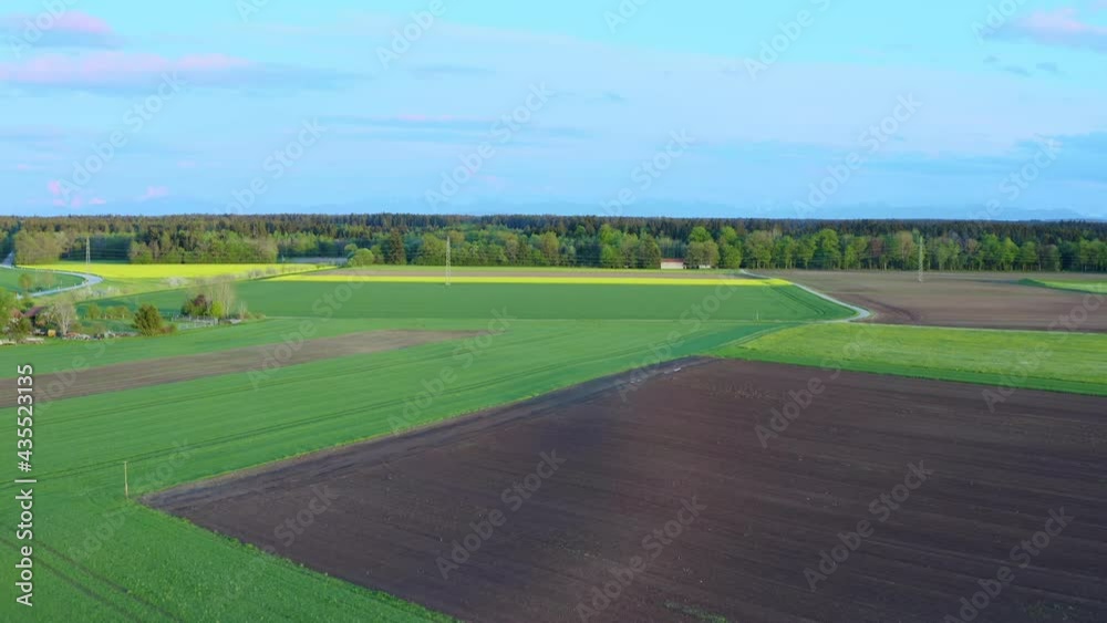 Wonderful view over blooming fields at springtime from a high angle view by a drone with vivid colors Wonderful view over blooming fields at springtime from a high angle view by a drone with vivid colors