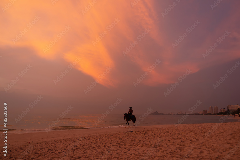 Horse riding silhouette on Hua Hin Beach, Thailand