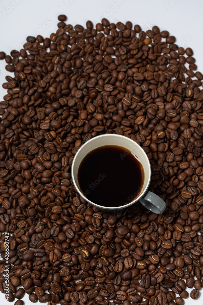 Coffee beans and coffee on a white background Coffee beans and coffee on a white background