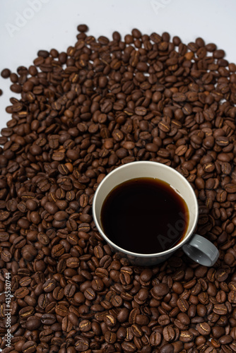 Coffee beans and coffee on a white background