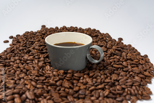 Coffee beans and coffee on a white background