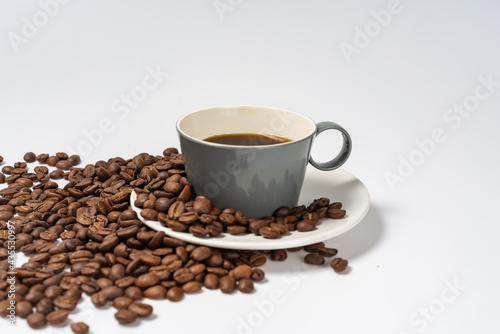 Coffee beans and coffee on a white background