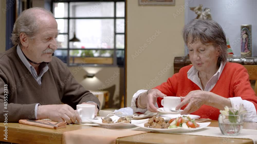 Senior adult man and woman in restaurant Senior adult man and woman in restaurant