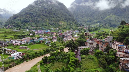 Beautiful village,  river with green fields  Nepal, Aerial drone view photo