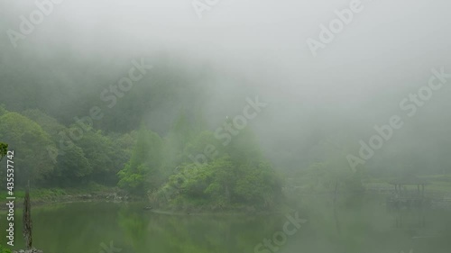 The scenery is like a dream while the clouds and mist are drifting around.The Mingchi is a high mountain lake with a cool and pleasant climate, located in Yilan County, Taiwan. photo