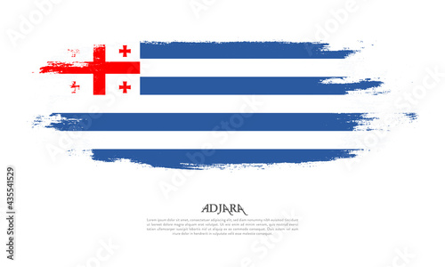 Adjara flag brush concept. Flag of Adjara grunge style banner background
