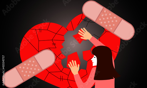 Concept of taking care of self improvement from disappointment and regret. Young woman is assembling picture and applying plaster to cover broken heart.