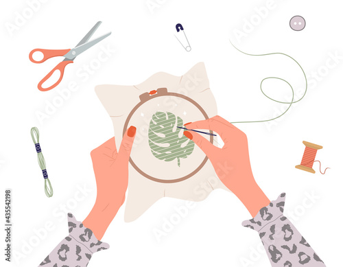 Embroidery process. Workshop, needlework and knitting. Female hands with needle and thread. Top view of the workplace. Tailor shop elements. Hand drawn vector illustration in flat cartoon style.