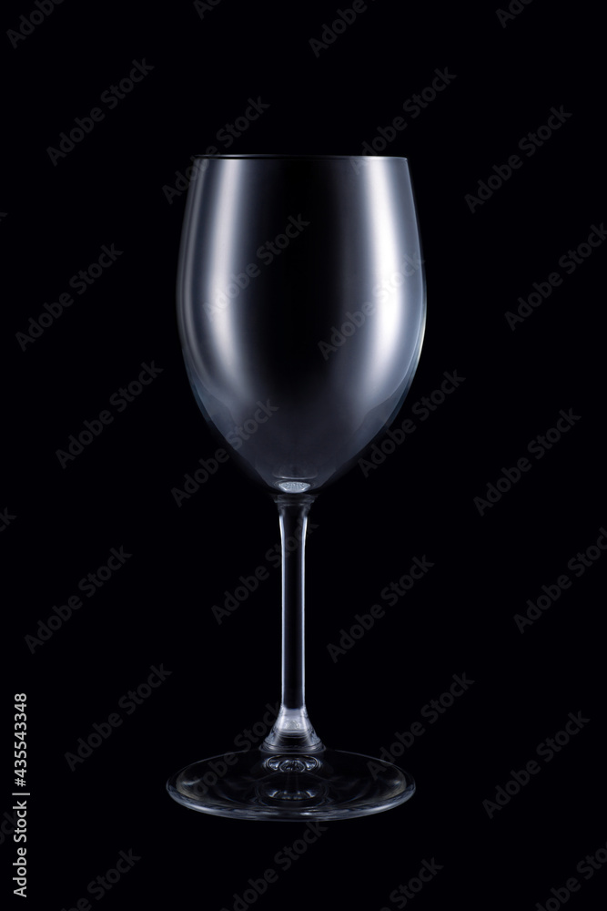 Empty wine glass isolated on dark background. Studio Empty wine glass isolated on dark background. Studio