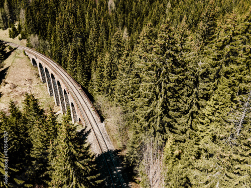 Historic railway viaduct situated in the forest near Telgart in Slovakia Aerial view. Chmarossky viadukt. Slovakia landscape. photo