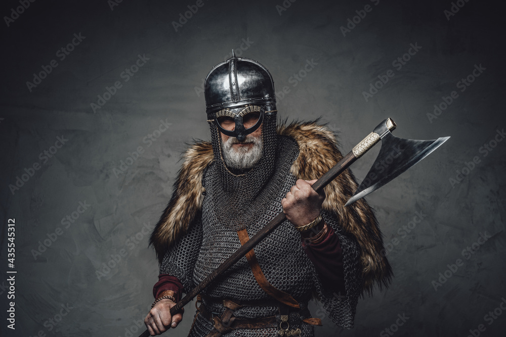 Naklejka premium Studio shot of antique old age viking with axe