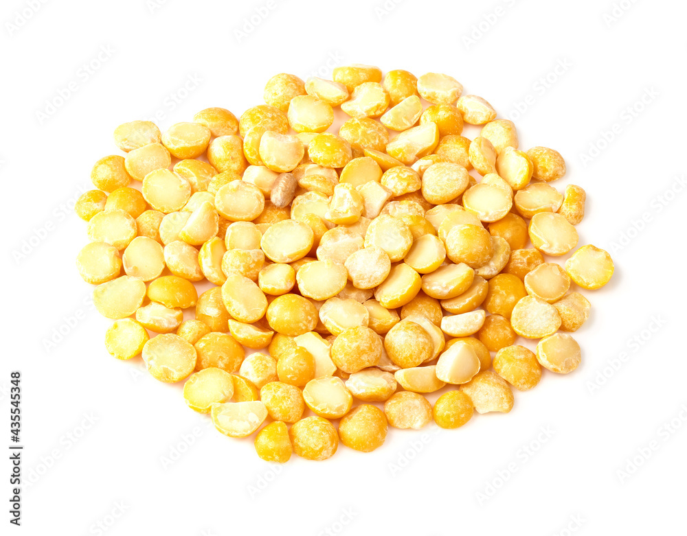 pile of dried split yellow peas closeup on white pile of dried split yellow peas closeup on white
