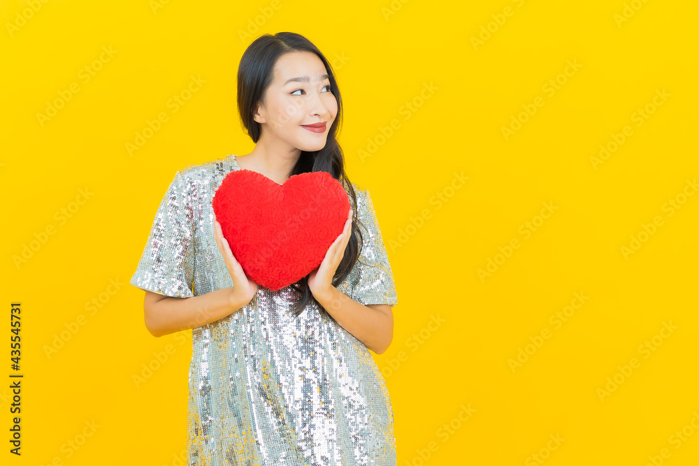 Portrait beautiful young asian woman smile with heart pillow shape Portrait beautiful young asian woman smile with heart pillow shape