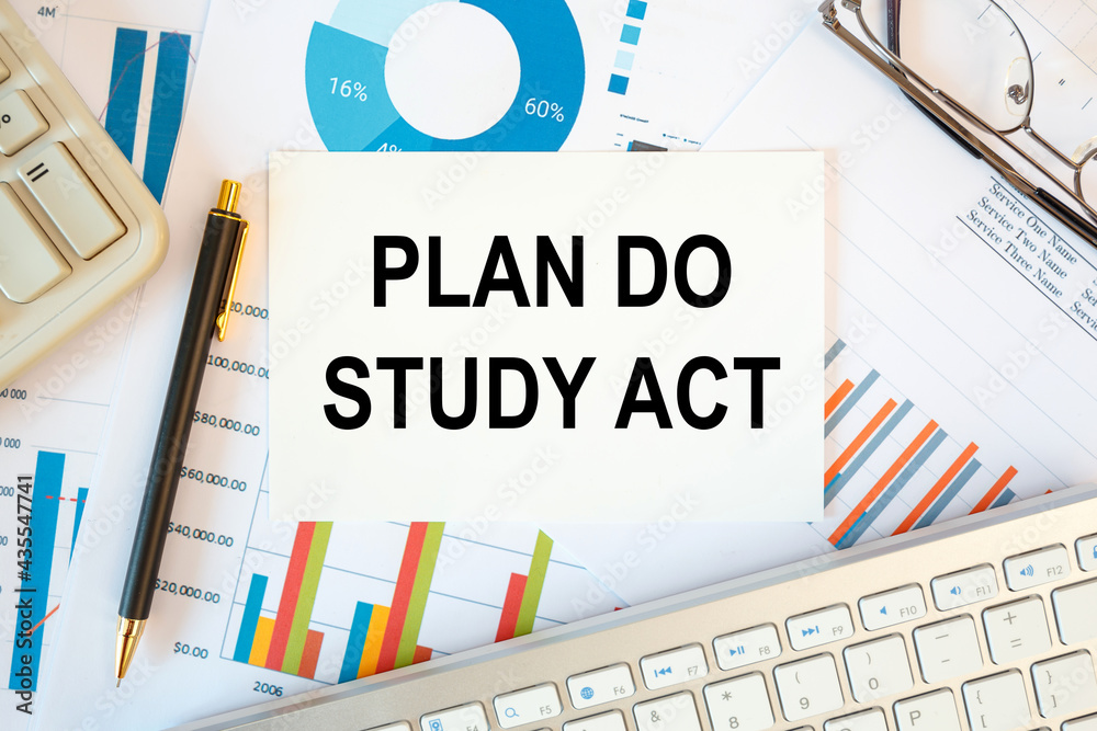 Obraz premium PLAN DO STUDY ACT is written in a document on the office desk, keyboard and diagram