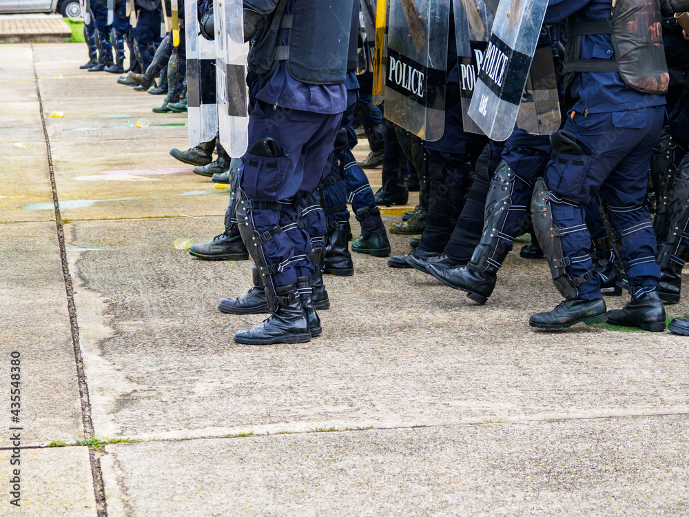 Riot police practice shields and baton Riot police practice shields and baton