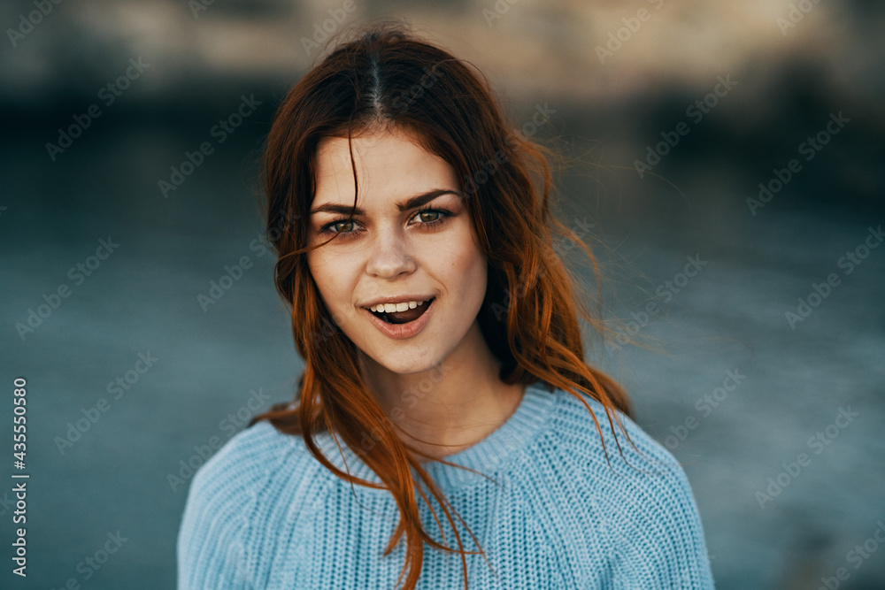red-haired woman outdoors enjoying the nature of Freedom red-haired woman outdoors enjoying the nature of Freedom