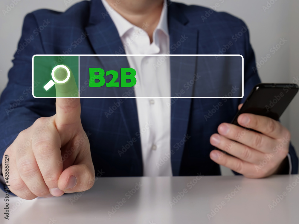 business-to-business B2B phrase on the screen. Modern Banker use cell technologies at office. Concept search and business-to-business B2B . business-to-business B2B phrase on the screen. Modern Banker use cell technologies at office. Concept search and business-to-business B2B .