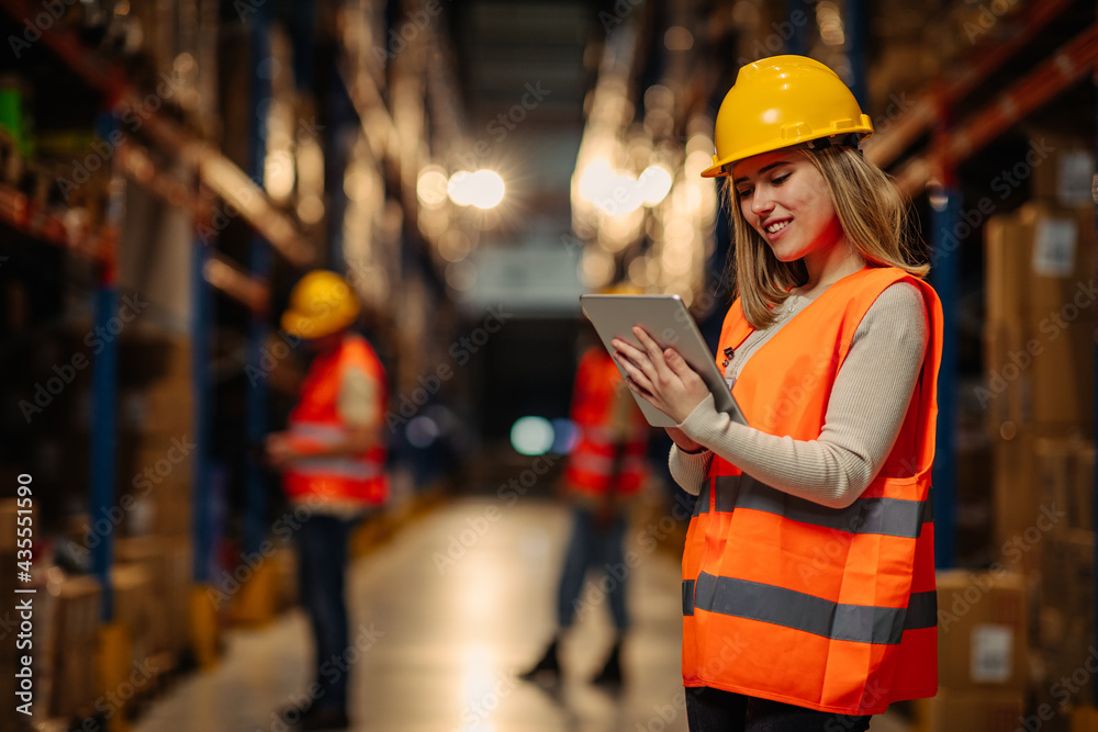 Female worker using tablet at warehouse Female worker using tablet at warehouse