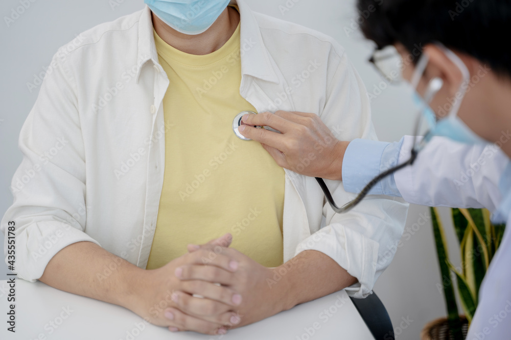 Doctor with patient consultation in medical office. Visiting Physician concept Doctor with patient consultation in medical office. Visiting Physician concept