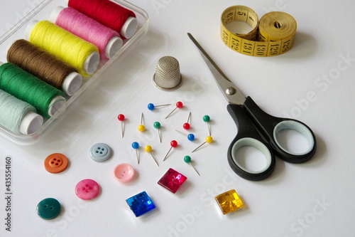 High angle view of sewing items on white background © Vedrana