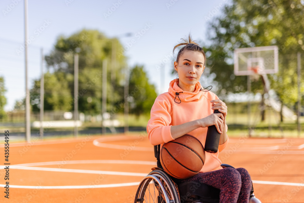 Sporty girl, looking at camera, sitting in a wheelchair, disability. Sporty girl, looking at camera, sitting in a wheelchair, disability.