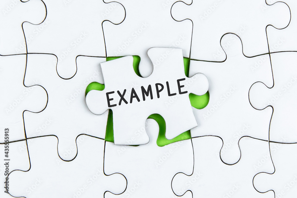 The word EXAMPLE is written on a Jigsaw Puzzle The word EXAMPLE is written on a Jigsaw Puzzle