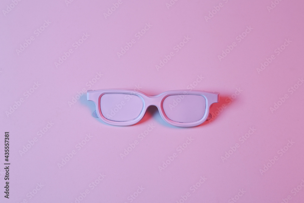 White glasses in pink-blue neon light. Minimalism music concept White glasses in pink-blue neon light. Minimalism music concept