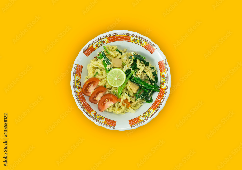 Indonesian Mie Goreng or Fried Noodle with egg traditional Indonesian or Chinese food with mustard greens Indonesian Mie Goreng or Fried Noodle with egg traditional Indonesian or Chinese food with mustard greens