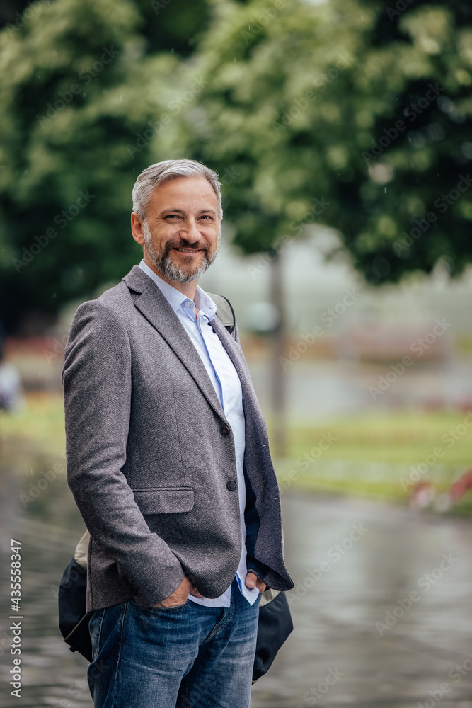 Energetic adult man, posing for the camera in the park. Energetic adult man, posing for the camera in the park.