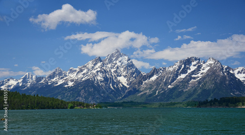 beautiful view of mount moran and the teton range on a sunny summer day from jackson lake dam in grand teton national park in wyoming