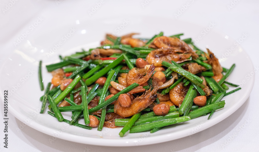 Fried river shrimp with leek on white background Fried river shrimp with leek on white background