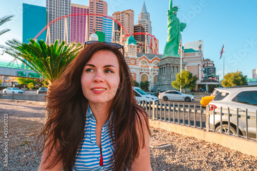 A young woman walks through the streets of the city with hotels in Las Vegas. Las Vegas, USA - 18 Apr 2021