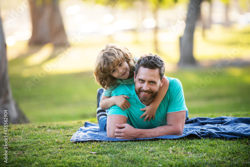 Wallpaper Mural Happy father and little boy son walking in summer park. Torontodigital.ca