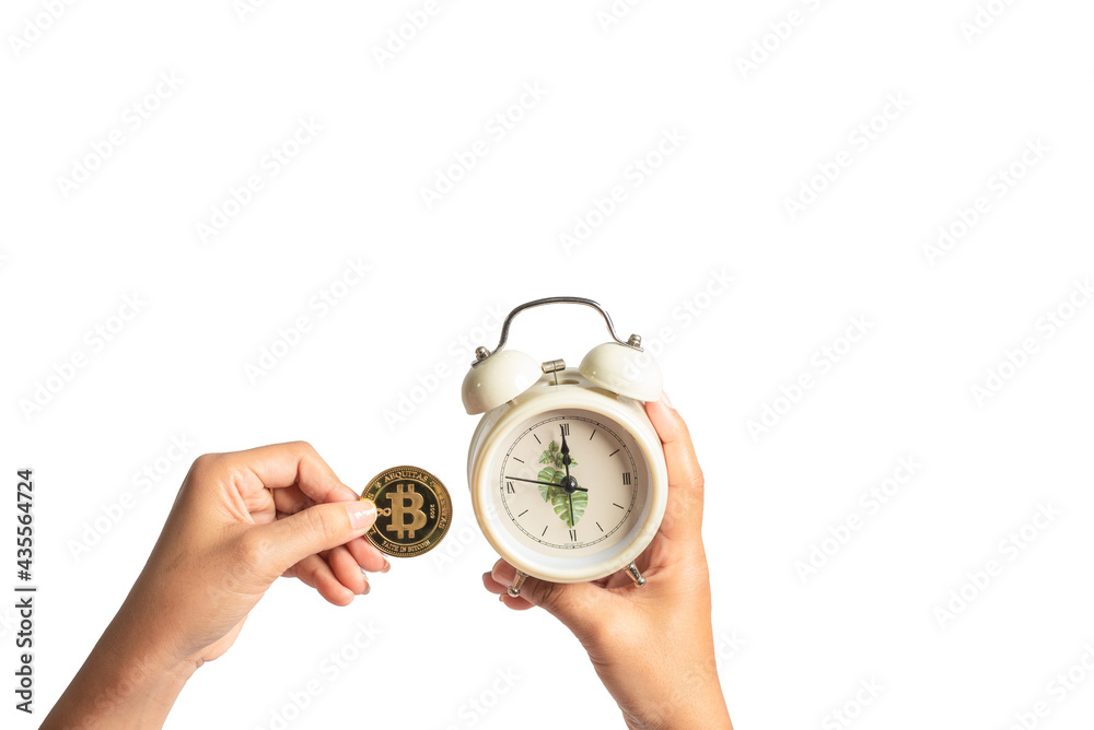 bitcoin and alarm clock Money and time concept separated from white background bitcoin and alarm clock Money and time concept separated from white background