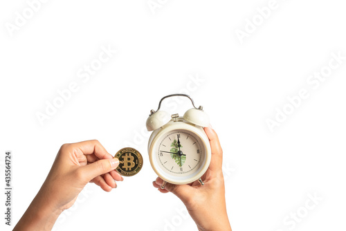 bitcoin and alarm clock Money and time concept separated from white background