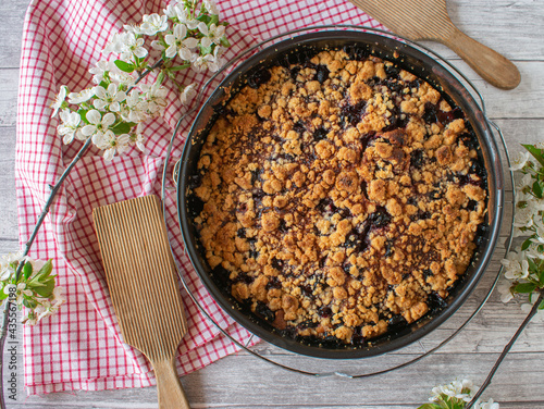 fresh baked cherry crumble pie in a springform pan  photo