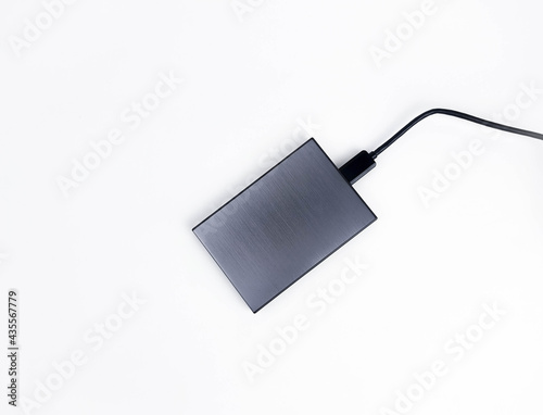 Gray external hard drive for data storage isolated on white background