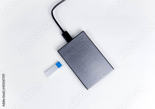 Gray External hard drive HDD and USB flash memory isolated on the white background