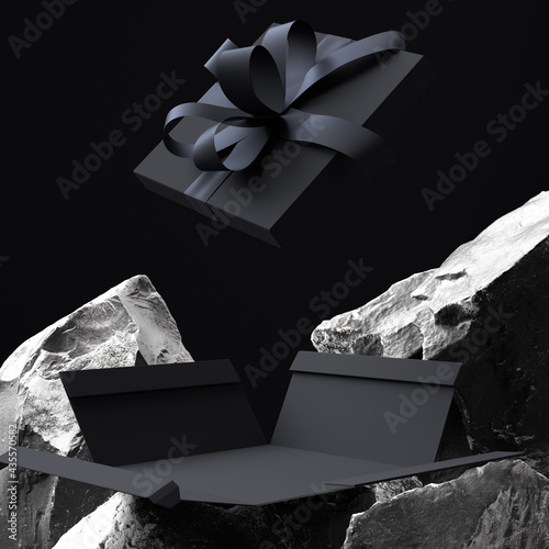 Black gift box wrap among black and white rocks, abstract product presentation, gift present for men, sale banner concept 3d rendering background photo