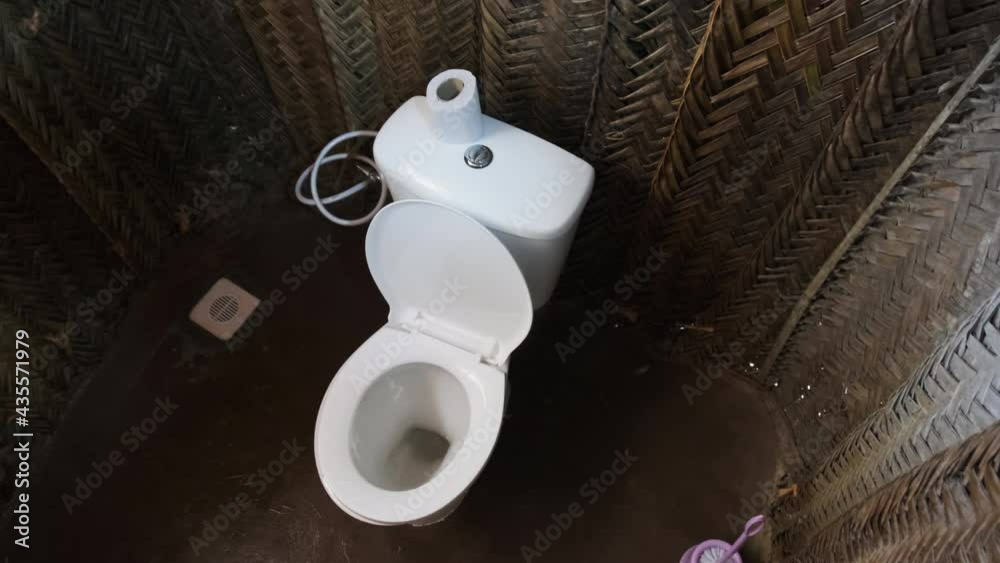 Toilet in an African grass hut, Zanzibar. Bathroom in a small thatched