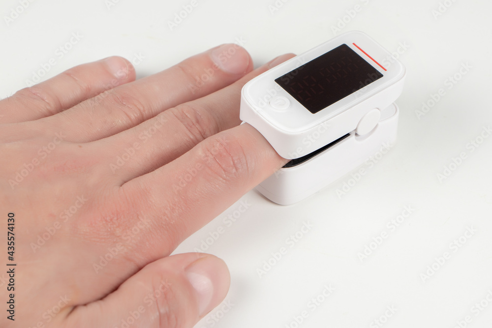 A pulse oximeter used to measure pulse rate and oxygen levels A pulse oximeter used to measure pulse rate and oxygen levels