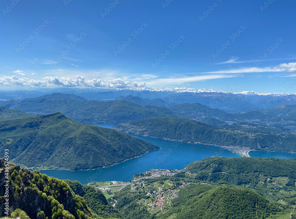 Panorama View from Top of Monte Genereso, Ticino, Switzerland. View to Lugano city, San Salvatore mountain and Lugano lake. 