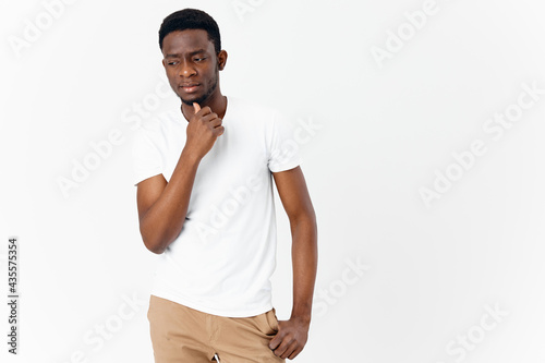 emotional man in white t-shirt pensive look isolated background