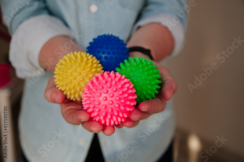 Person holding Colorful Physical therapy balls. Sujok acupressure therapy concept. Sujok balls in the persons hand. 
