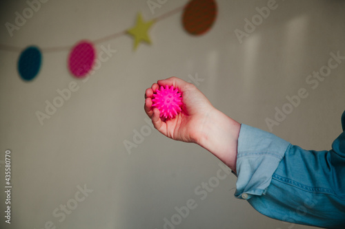 Person holding Colorful Physical therapy balls. Sujok acupressure therapy concept. Sujok balls in the persons hand. 
