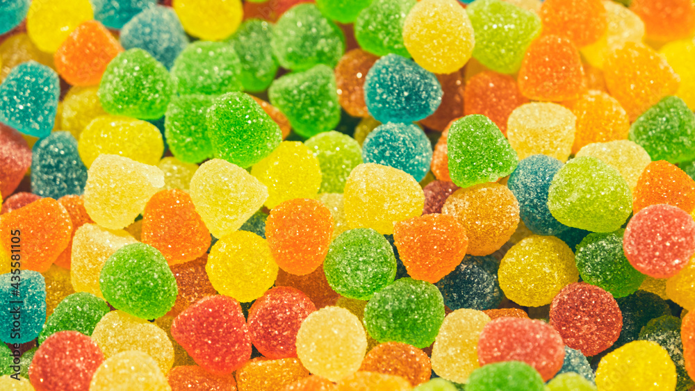 Sugar-filled gelatine sweets. Background from multi-colored jellies. Sugar-filled gelatine sweets. Background from multi-colored jellies.